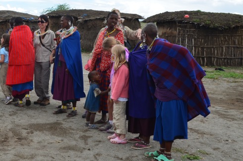 The girls interacting with the Masai people.  They were all warm and friendly and "down to earth."  Check out that adorable little boy who couldn't keep his eyes off these 'light' people.