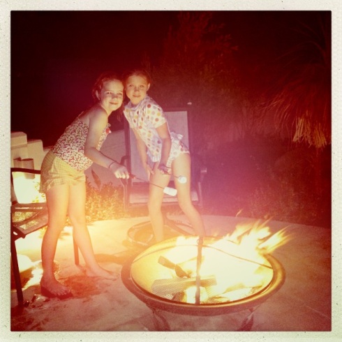 At a friends' house making s'mores on their fire pit....some things are just like home.  Molly and her friend Mallory.