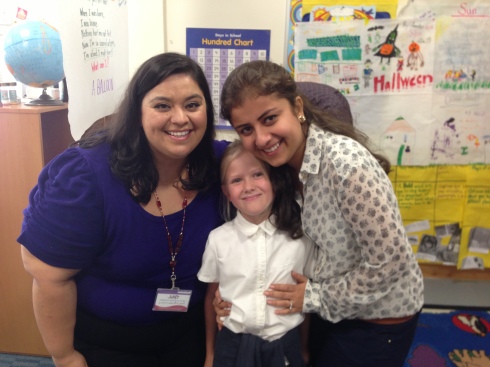 Lucy and her teacher Ms. Gonzalez and para (teacher helper) Ms. Neha.