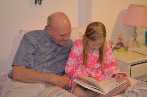 Lucy and Dad reading.