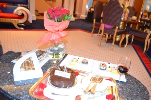 Look what they brought us - canapes, dozen red roses, wine, chocolate cake, and a cute little box filled with arabic sweets!